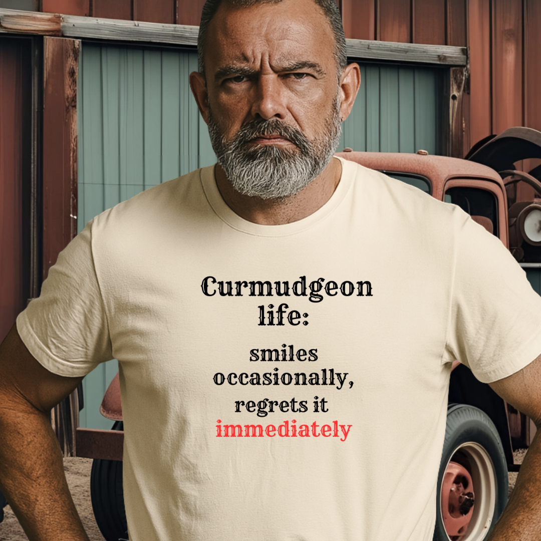 SMILES.™ – And Instantly Regrets It A tee for the man who accidentally showed emotion.
