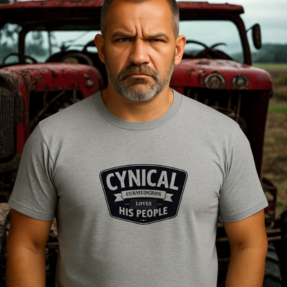 Grumpy man in Cynical Curmudgeon tee with “Loves His People” graphic